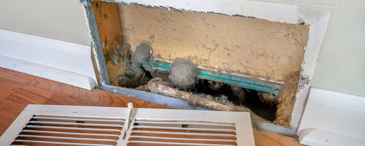 photo shows a dirty furnace vent and duct