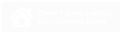Sign with a house icon and text that reads: "Open 7 days a week. No overtime rates.
